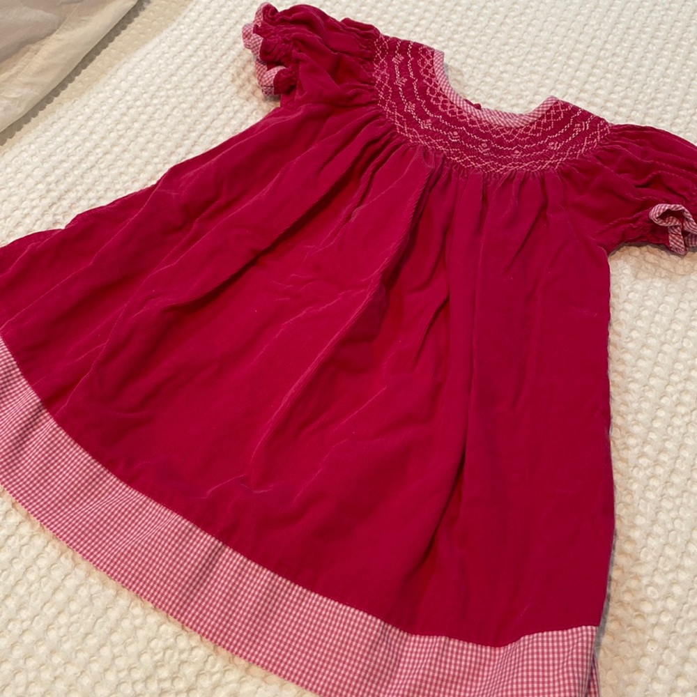 Smocked. Corduroy. Gingham trim. Bishop sleeve.